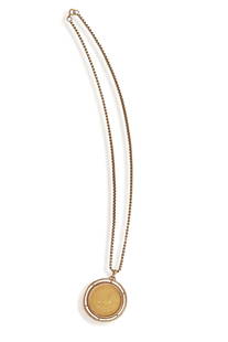 A SOUTH AFRICAN GOLD KRUGERRAND PENDANT, 1974 within a beaded circular bezel and suspended on a 9ct: A SOUTH AFRICAN GOLD KRUGERRAND PENDANT, 1974 within a beaded circular bezel and suspended on a 9ct gold, fancy link necklace