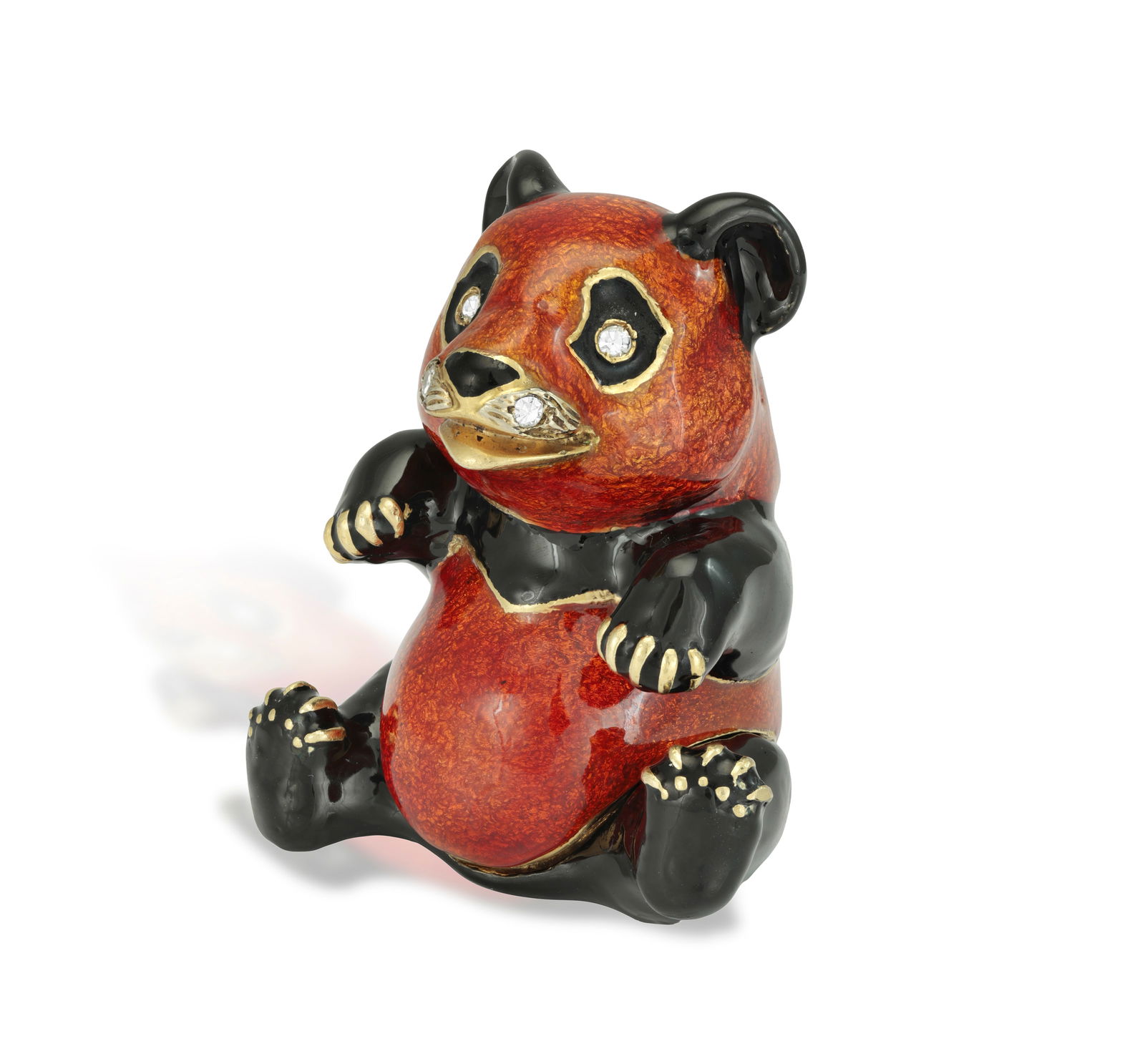 AN ENAMEL AND DIAMOND NOVELTY PILL BOX, BY FRASCAROLO, CIRCA 1965 Modelled as a panda decorated wit: AN ENAMEL AND DIAMOND NOVELTY PILL BOX, BY FRASCAROLO, CIRCA 1965 Modelled as a panda decorated with orangy-red and black enamel with single-cut diamonds for eyes and muzzle, opening to reveal a polis