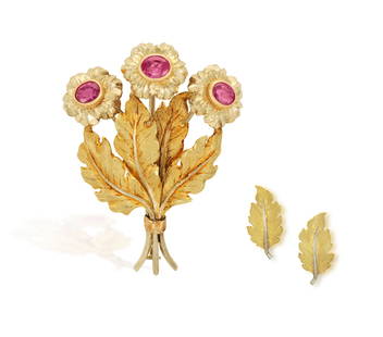 A RUBY FLOWER BROOCH, WITH A PAIR OF EARRINGS EN SUITE, BY MARIO BUCCELLATI Designed as a floral sp: A RUBY FLOWER BROOCH, WITH A PAIR OF EARRINGS EN SUITE, BY MARIO BUCCELLATI Designed as a floral spray, the textured gold stem and leaves extending to textured gold undulating leaves, enhanced with