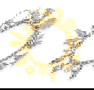 A GOLD CHARM BRACELET The fancy-link chain suspending fifteen charms including a lion, a poodle, Sa: A GOLD CHARM BRACELET The fancy-link chain suspending fifteen charms including a lion, a poodle, Saint Paul's cathedral etc... bracelet in 18K gold, by Uno A Erre, Italian registry mark between 1944-1