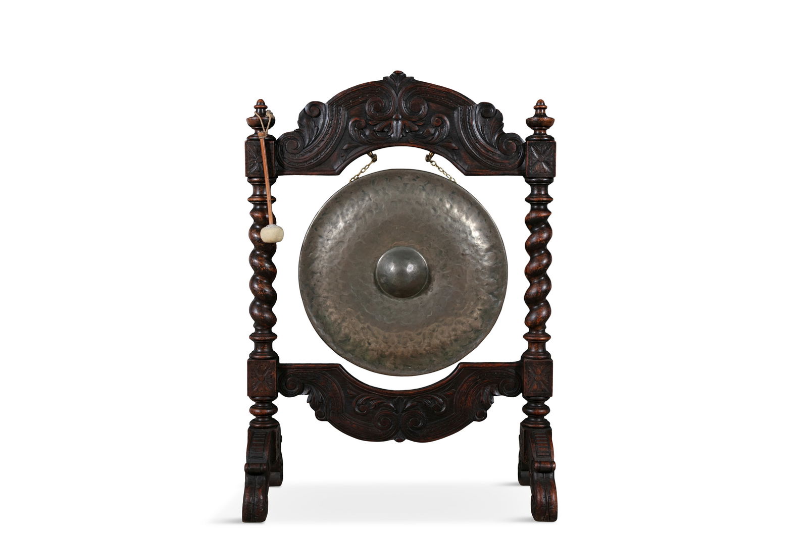 A CARVED AND STAINED OAK FRAMED BRASS DINNER GONG AND BEATER  the frame with all over (1 of 5)