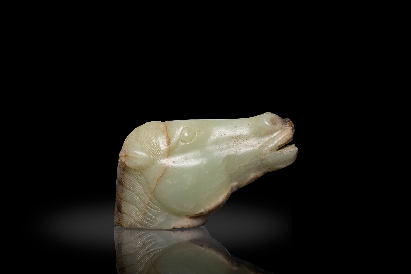A CELADON AND RUSSET JADE HORSE HEAD   明代 白玉馬首  China, (1 of 2)