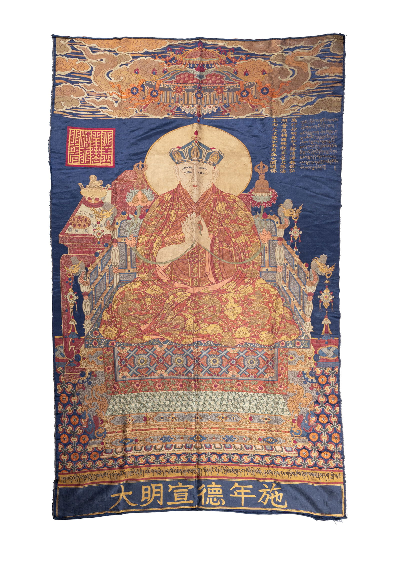 A SILK BROCADE THANGKA OF THE PORTRAIT OF THE MONASTIC PATRONAGE SHAKYA YESHE WITH THREE (1 of 3)