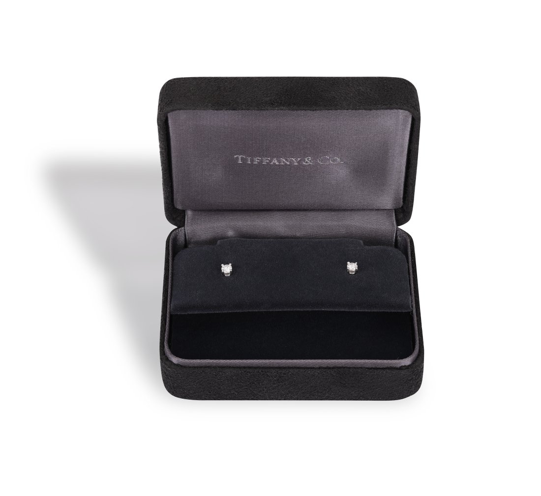 A PAIR OF DIAMOND EARSTUDS, BY TIFFANY & CO., each brilliant-cut diamond set within a four-claw (1 of 4)