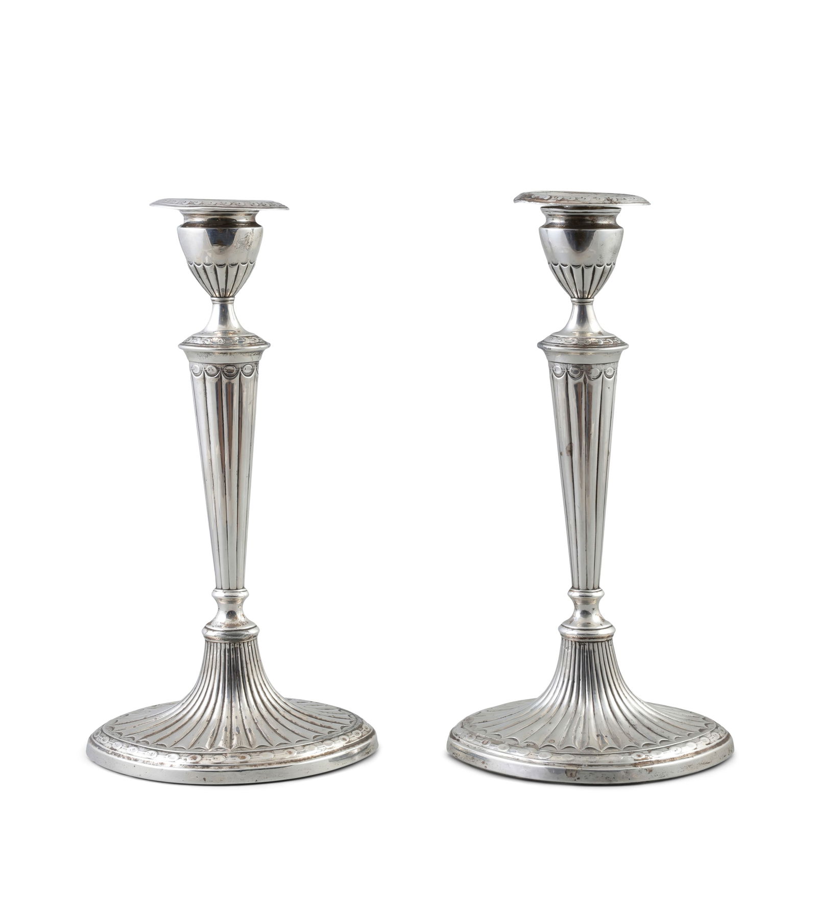 A PAIR OF GEORGE III SILVER CANDLESTICKS  Sheffield, c.1785, mark of Luke Proctor & Co, each of (1 of 2)