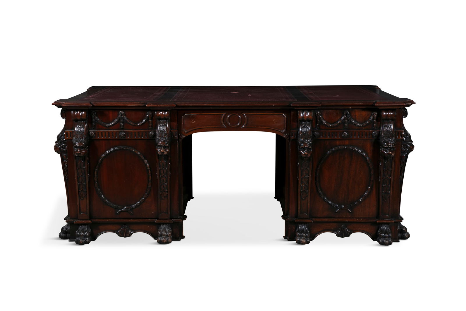 A MAHOGANY TWIN PEDESTAL PARTNER'S DESK, following a design of Thomas Chippendale of 1740, the: A MAHOGANY TWIN PEDESTAL PARTNER'S DESK, following a design of Thomas Chippendale of 1740, the rectangular top with outset corners and three tooled leather writing panels, above a centre drawer, and p