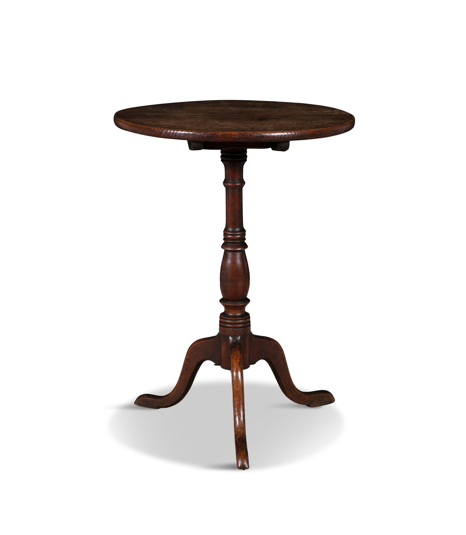 A GEORGE III OAK WINE TABLE with circular snap-top, on turned centre pillar and triform base.: A GEORGE III OAK WINE TABLE with circular snap-top, on turned centre pillar and triform base. 48.5cm diameter