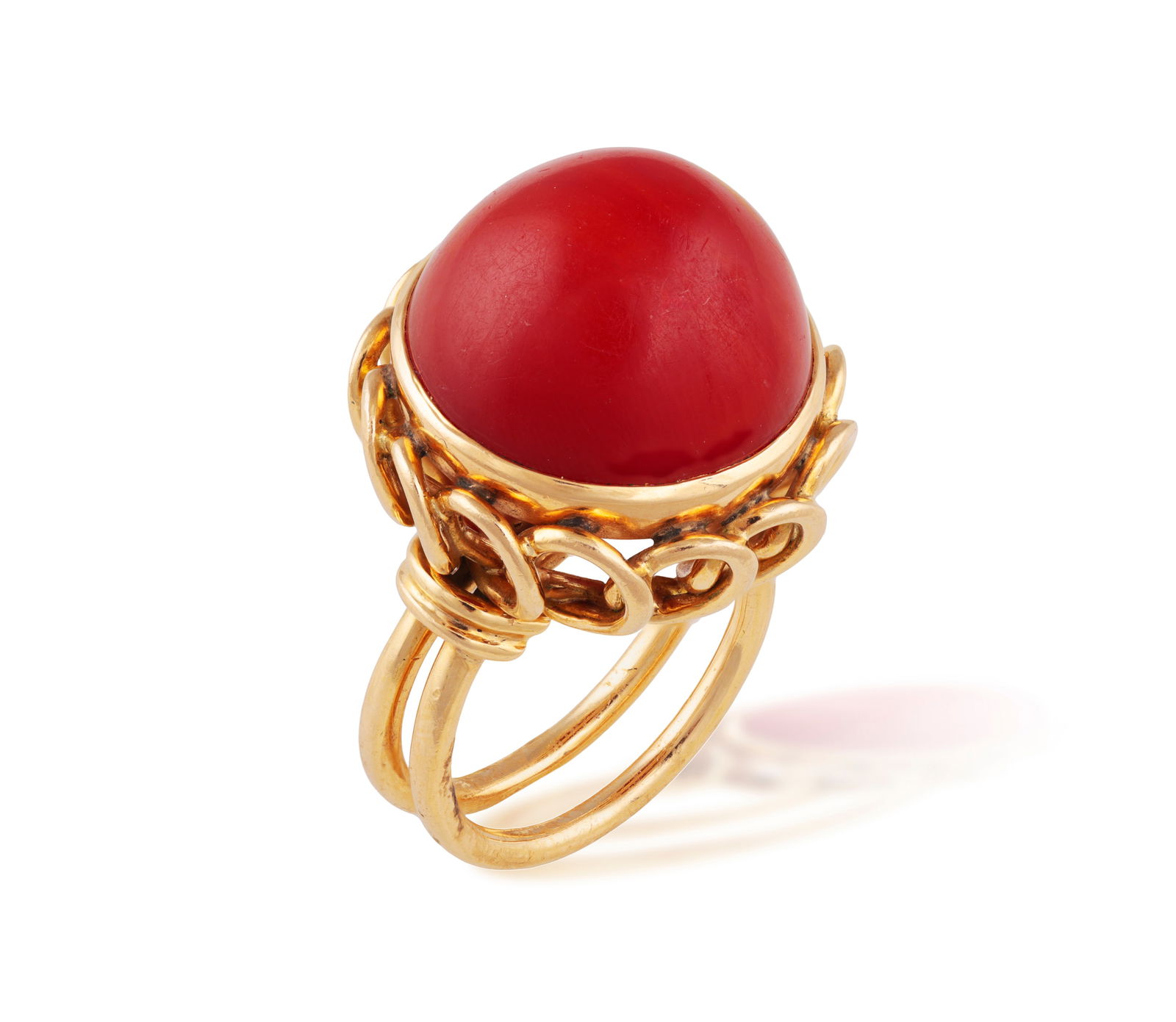 A RETRO CORAL RING, CIRCA 1960  The central circular corallium rubrum cabochon, raised by looped (1 of 4)