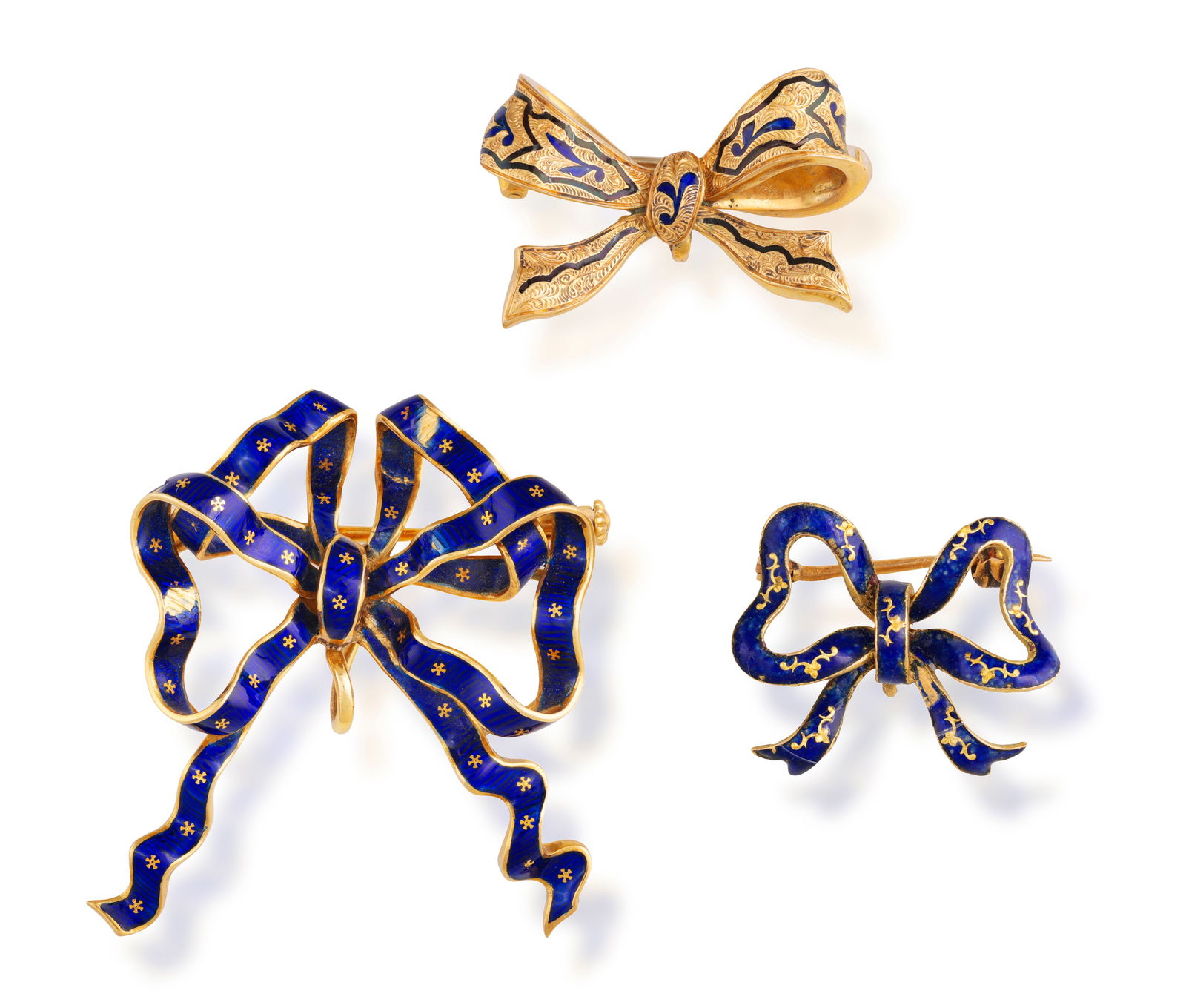 A GROUP OF THREE ENAMEL BROOCHES  Each designed as a stylised bow, decorated with blue enamel, (1 of 4)