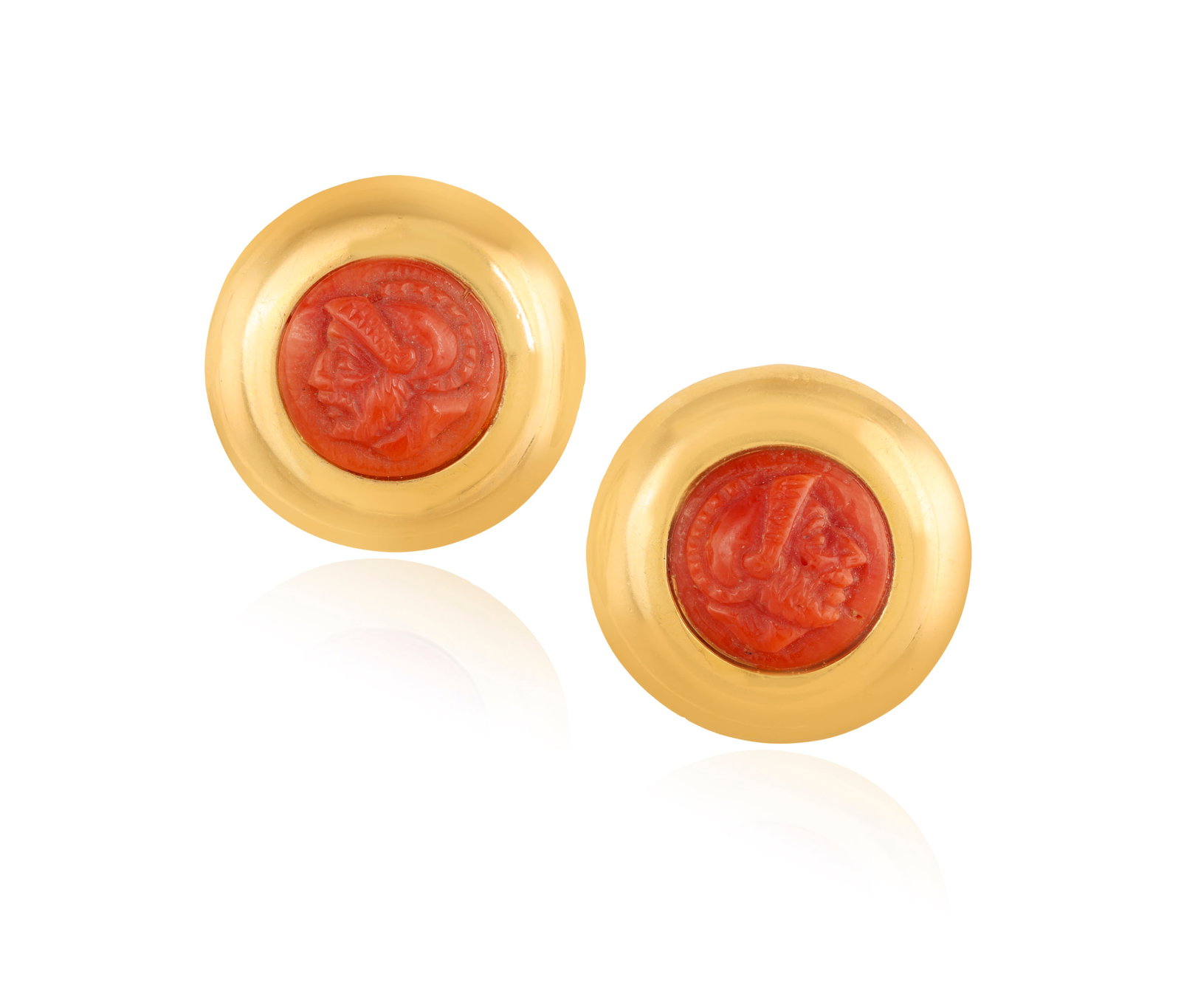 A PAIR OF CORAL EARRINGS Each polished circular-shaped mount, set with a coral cameo depicting a: A PAIR OF CORAL EARRINGS Each polished circular-shaped mount, set with a coral cameo depicting a profile of a man with a helmet, mounted in 18K gold, maker’s mark ‘ICU’, Italian registry mark, l