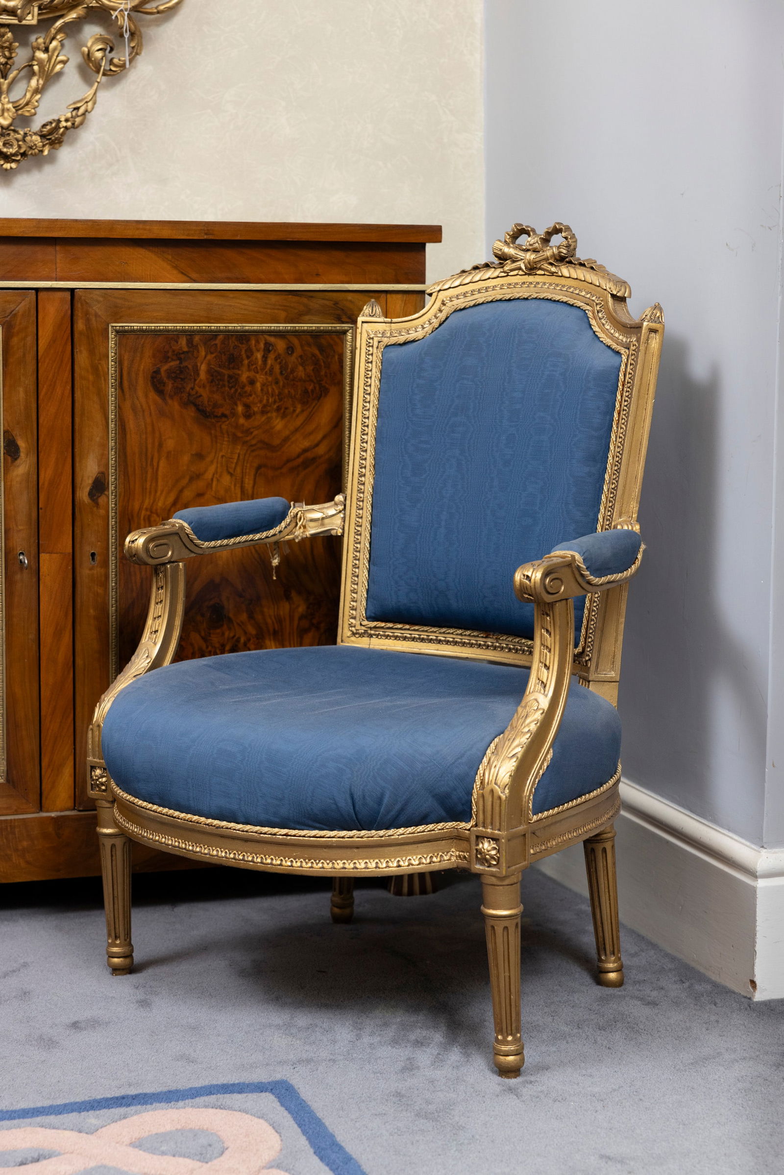 A SUITE OF LOUIS QUINZE STYLE GILT-PAINTED FURNITURE, comprising: two settees, four gentleman?s: A SUITE OF LOUIS QUINZE STYLE GILT-PAINTED FURNITURE, comprising: two settees, four gentleman?s armchairs, two ladies armchairs, four single chairs and a footstool. The settees: 168cm wide x 107cm hig