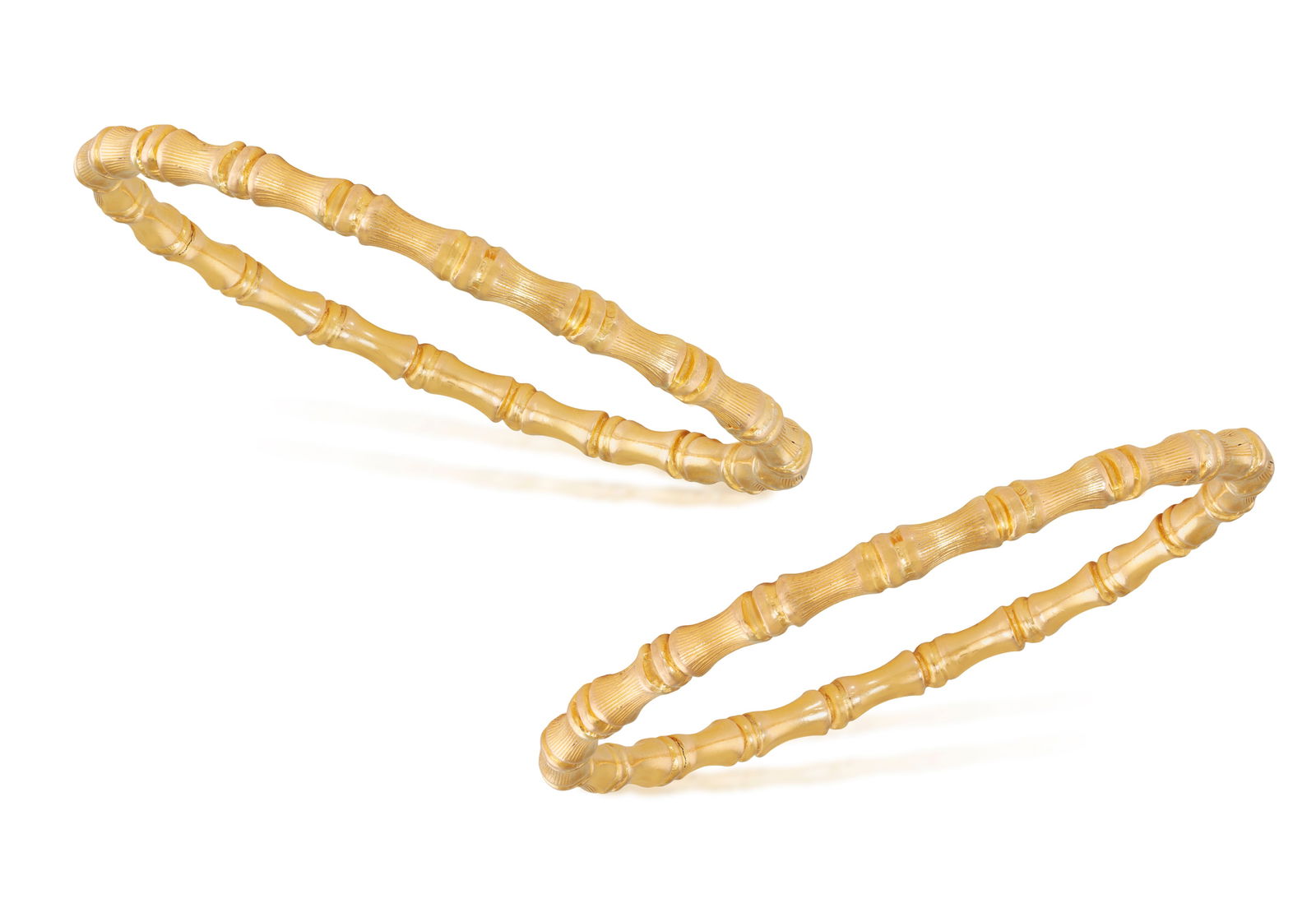 A PAIR OF GOLD BANGLE BRACELETS              Each bangle of bamboo motifs, in 22K gold, inner (1 of 3)