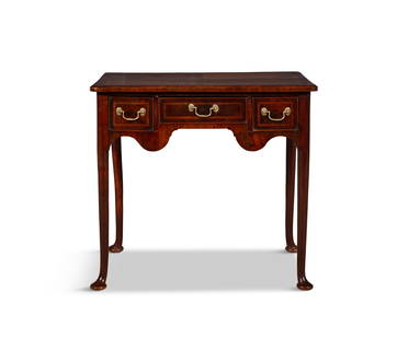 A GEORGE III WALNUT AND CROSSBANDED LOWBOY, the shaped rectangular top over a three drawer: A GEORGE III WALNUT AND CROSSBANDED LOWBOY, the shaped rectangular top over a three drawer frieze, shaped apron, on downswept legs with pad feet. 70cm high x 76cm wide x 51cm deep