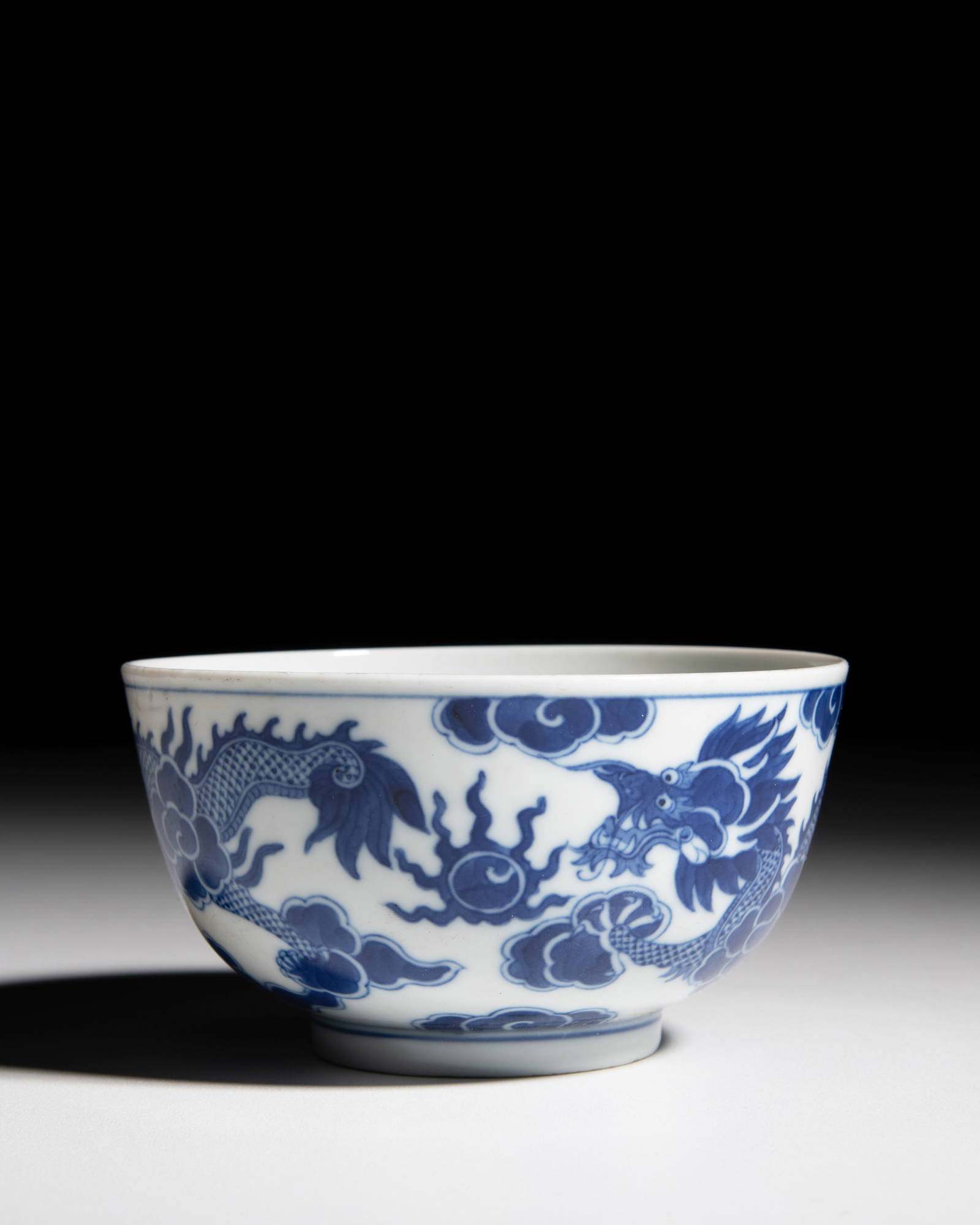 A 'BLEU DE HUE' DRAGONS BOWL, MARKED AND PERIOD OF MINH MANG (____) China for Vietnam, Minh Mang