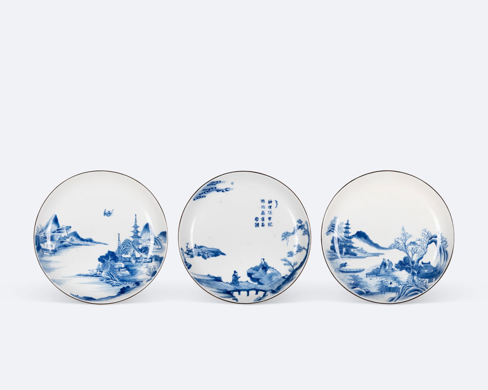 A GROUP OF THREE 'BLEU DE HUE' SCHOLARS AND LANDSCAPE DISHES  Vietnam, 19th century  Two plates are (1 of 4)