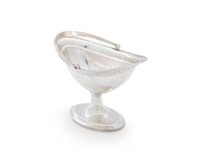 AN IRISH GEORGE III HELMET SHAPED SWING HANDLE SUGAR BOWL, Dublin 1792, mark probably that of: AN IRISH GEORGE III HELMET SHAPED SWING HANDLE SUGAR BOWL, Dublin 1792, mark probably that of Michael Homer, the oval body decorated with bright-cut engraving, raised on pedestal foot, (c.8 troy ozs).