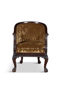 AN IRISH CARVED MAHOGANY TUB-BACK ARMCHAIR, with arched back covered in velvet damask upholstery,: AN IRISH CARVED MAHOGANY TUB-BACK ARMCHAIR, with arched back covered in velvet damask upholstery, padded seat, shell capped legs and paw feet