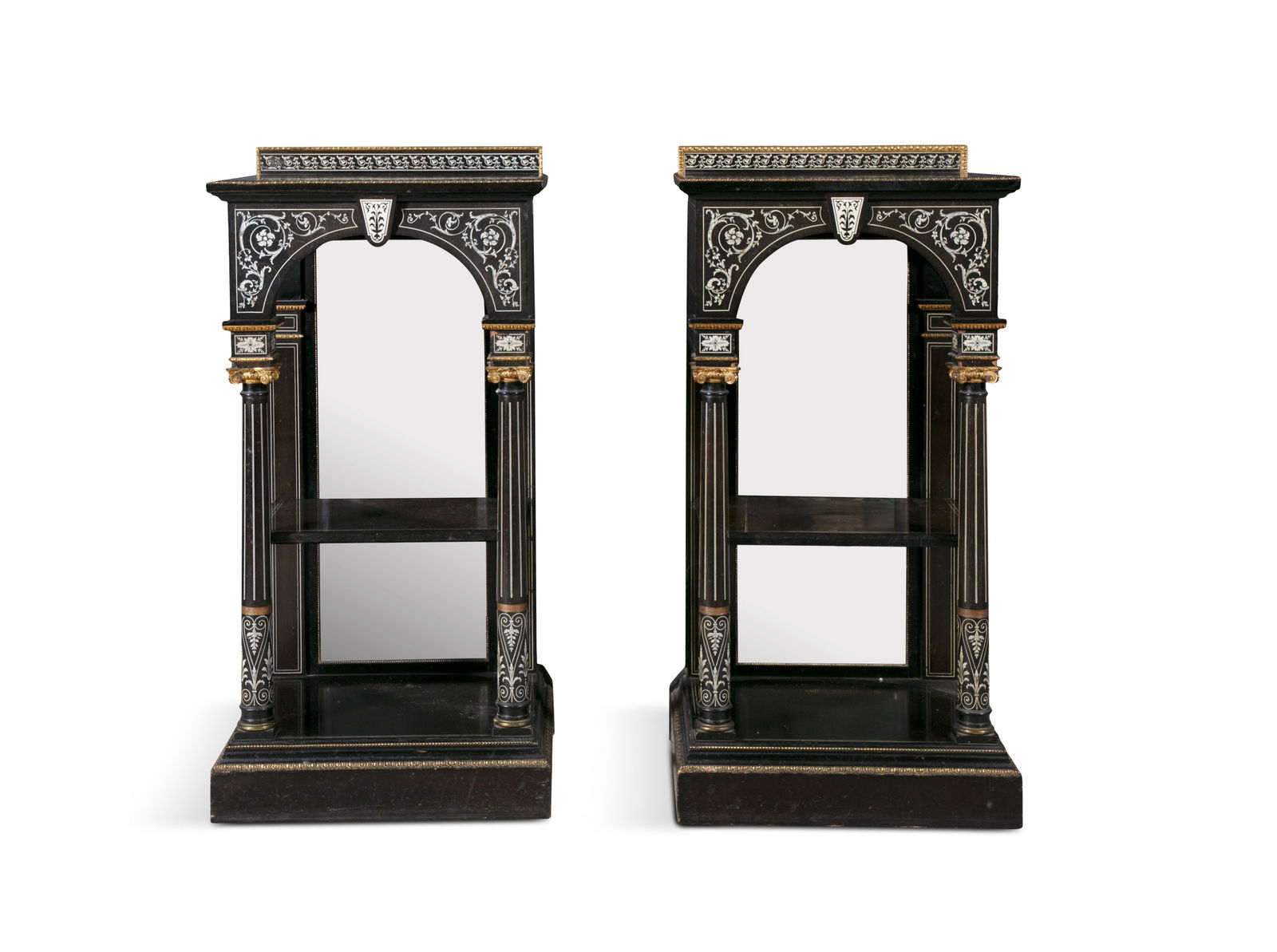*A PAIR OF VICTORIAN IVORY INLAID AND GILT METAL MOUNTED EBONY CONSOLE TABLES, of upright: *A PAIR OF VICTORIAN IVORY INLAID AND GILT METAL MOUNTED EBONY CONSOLE TABLES, of upright rectangular form, each with raised gallery back decorated with a band of inlaid ivory foliate scrollwork, abov