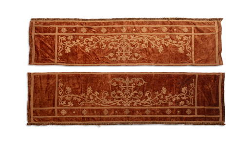 A PAIR OF BROWN VELVET WALL HANGINGS. 250 x 71CM rectangular field woven with scrolling foliage,: A PAIR OF BROWN VELVET WALL HANGINGS. 250 x 71CM rectangular field woven with scrolling foliage, fringed ends