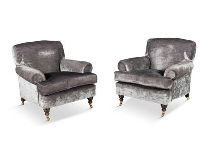 A PAIR OF MAHOGANY ARMCHAIRS, MODERN, each covered in grey mauve velvet, on ring-turned feet and: A PAIR OF MAHOGANY ARMCHAIRS, MODERN, each covered in grey mauve velvet, on ring-turned feet and brass caps and castors, 83cm high, 92cm wide, 89cm deep