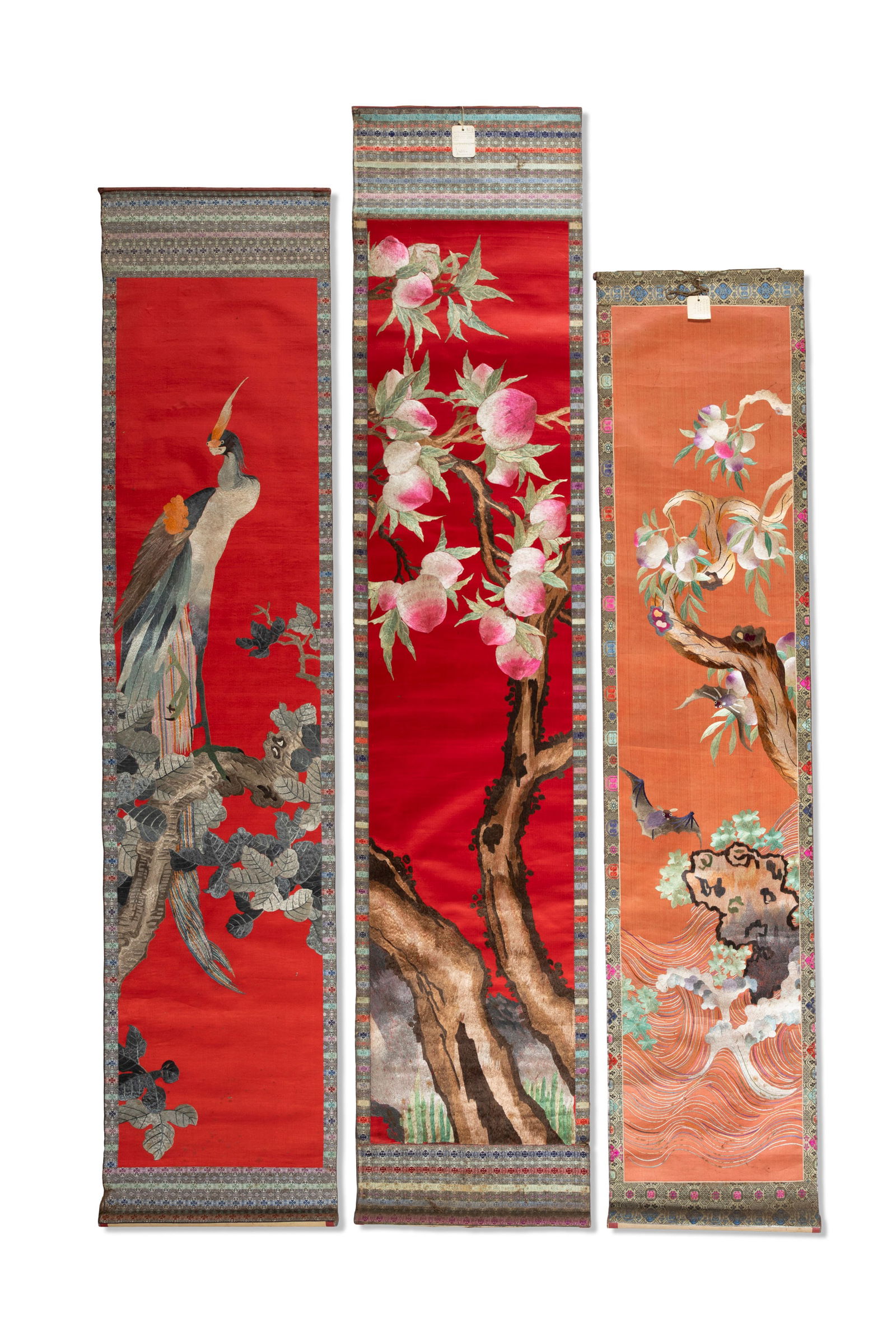 A PAIR OF 19TH CENTURY CHINESE SILK SCROLL WALL HANGINGS,   with red ground, the first finely (1 of 4)