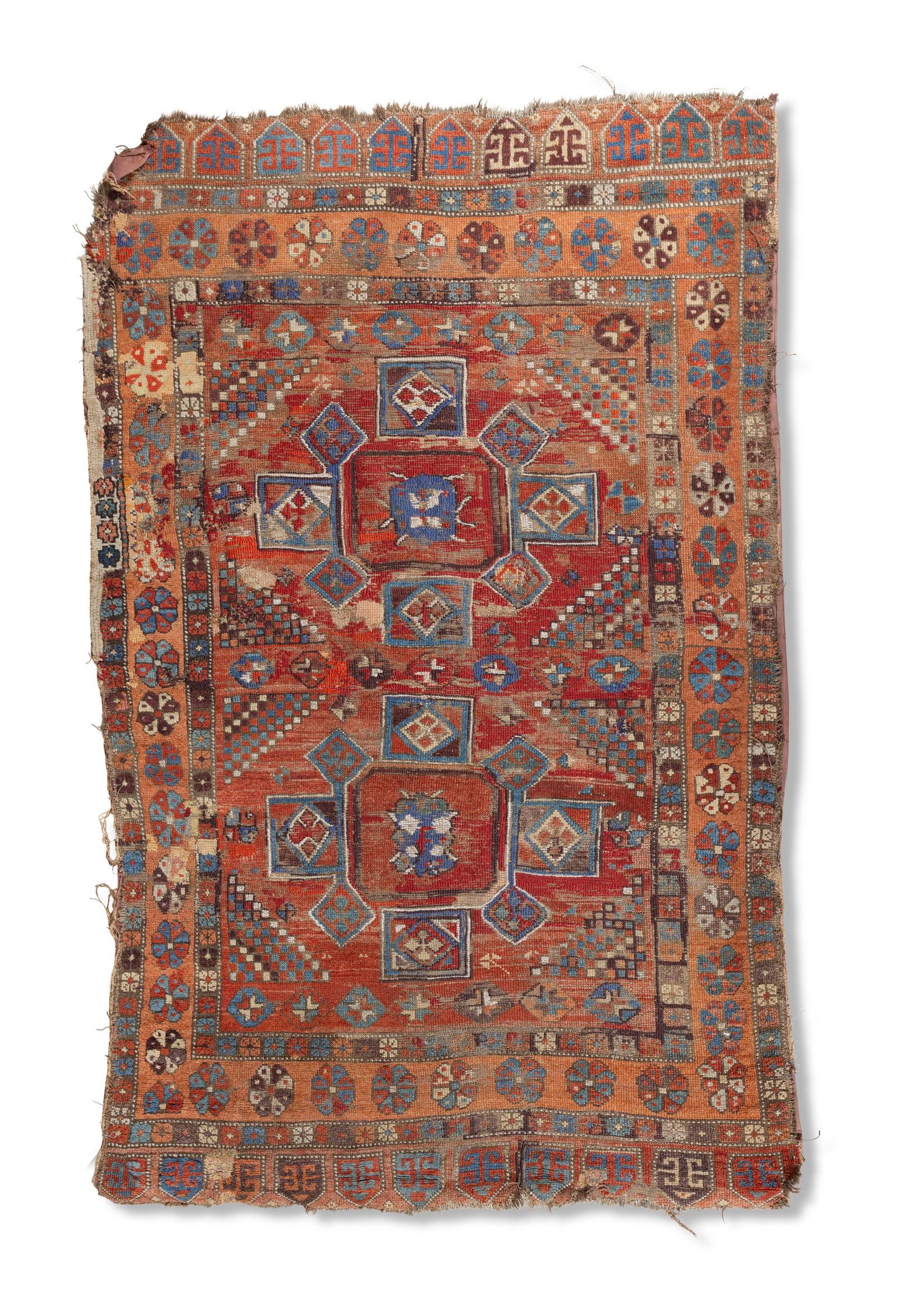 AN ANTIQUE KAZAK RUG,   the rectangular field with two octagonal medallions in blue, red and rust (1 of 4)