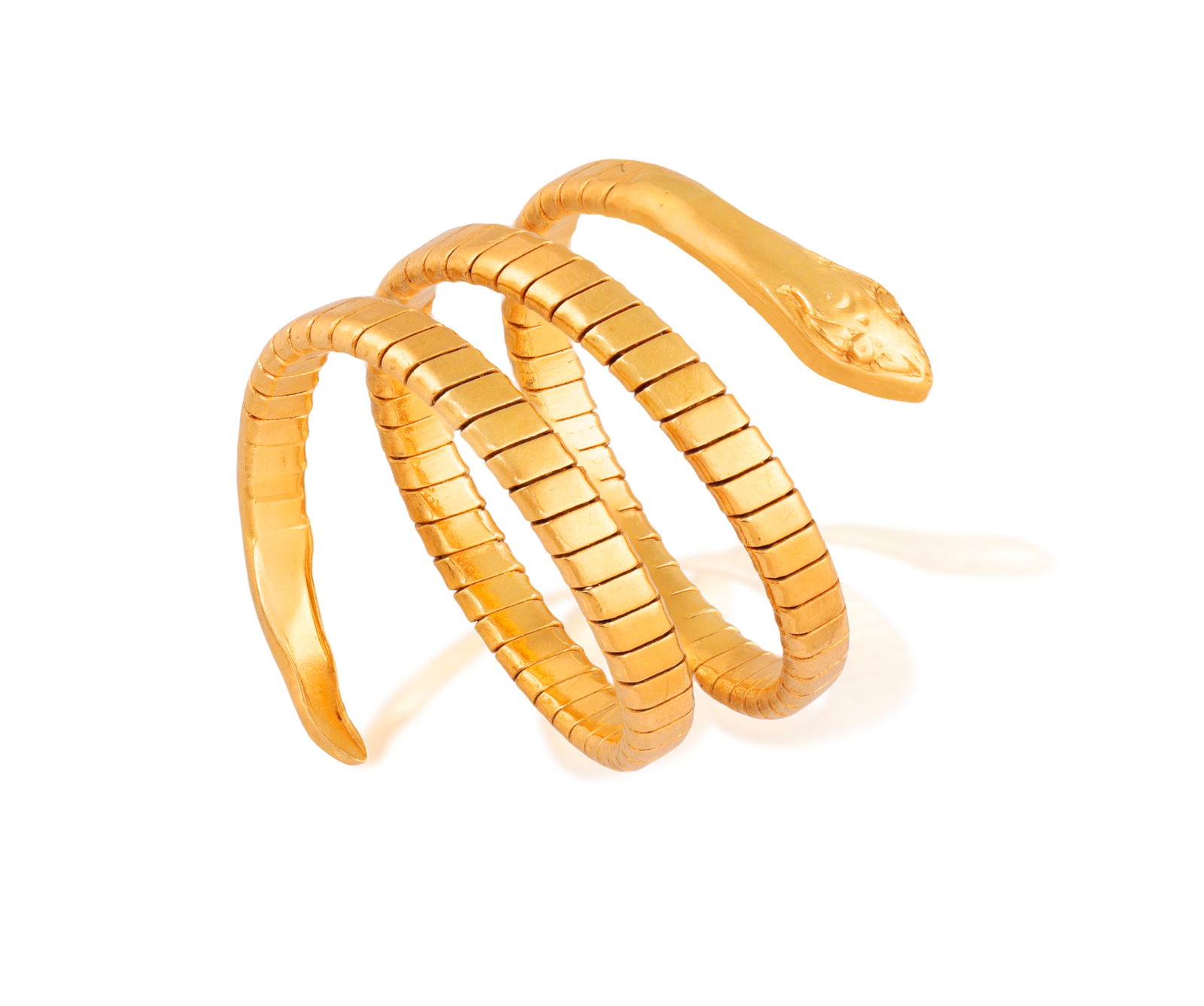 A GOLD RING  Modelled as a coiled snake, composed of gas-pipe linking, to a polished engraved gold (1 of 4)