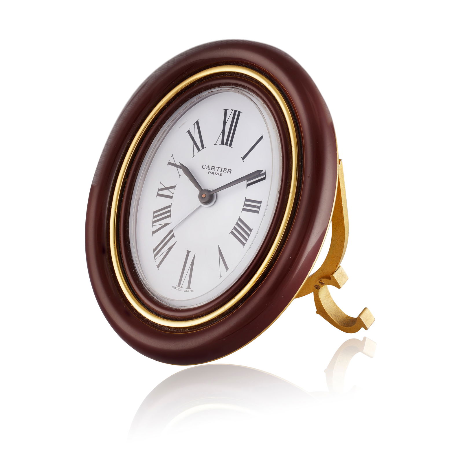 CARTIER: A ‘PENDULETTE’ ALARM DESK CLOCK   Of manual wind movement, the oval white dial (1 of 2)