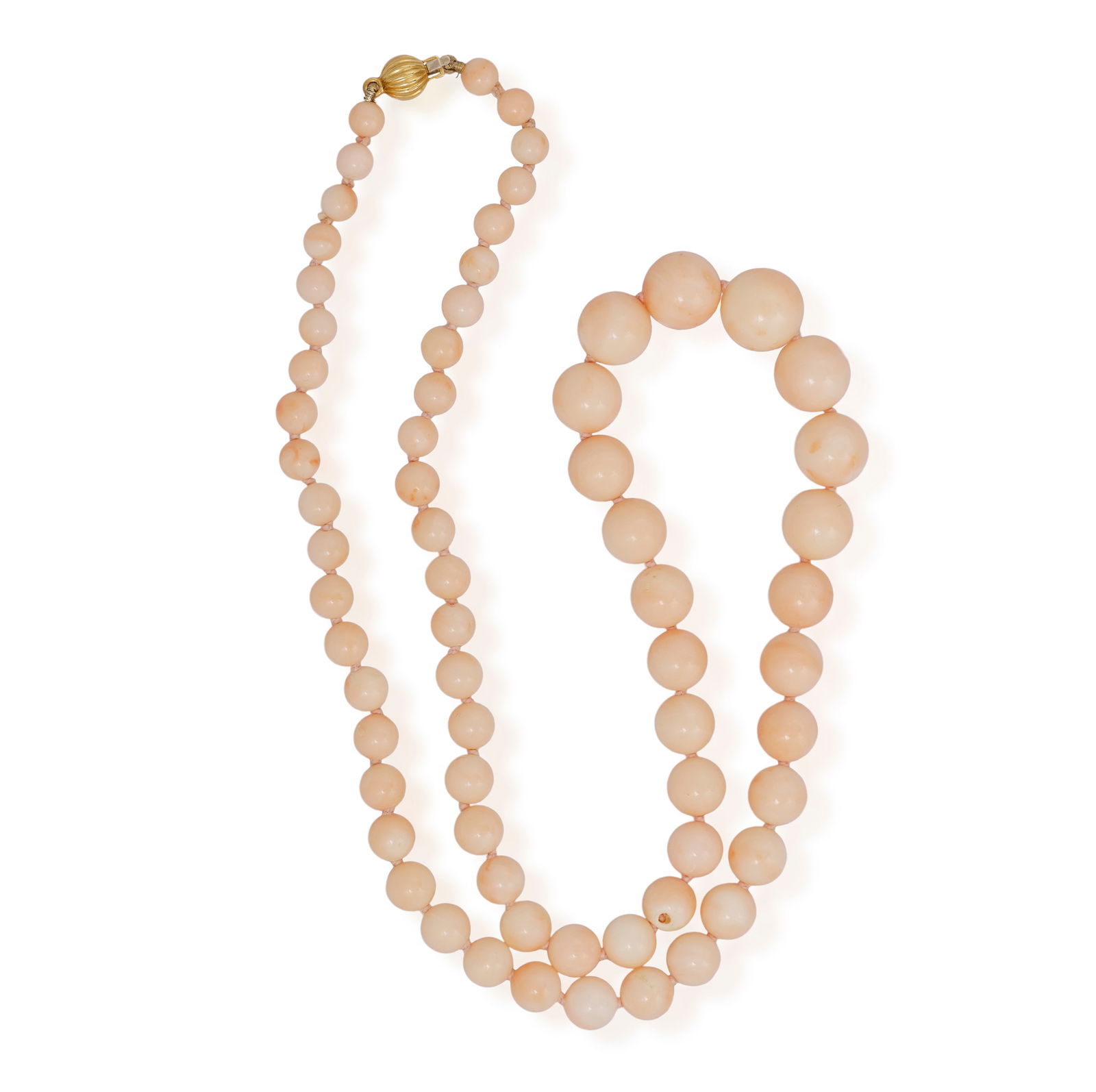 A CORAL BEAD NECKLACE Composed of a single strand of sixty-seven graduated angel-skin coral beads,: A CORAL BEAD NECKLACE Composed of a single strand of sixty-seven graduated angel-skin coral beads, measuring from 5.0 to 11.5mm, to a bead clasp of reeded design, length 53cm **Prospective buyers are