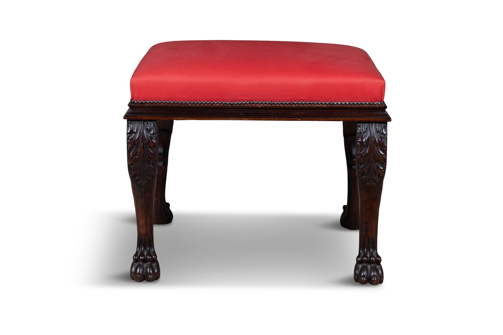 A MAHOGANY STOOL, 19TH CENTURY   rectangular padded seat upholstered in red close nail fabric, on (1 of 4)
