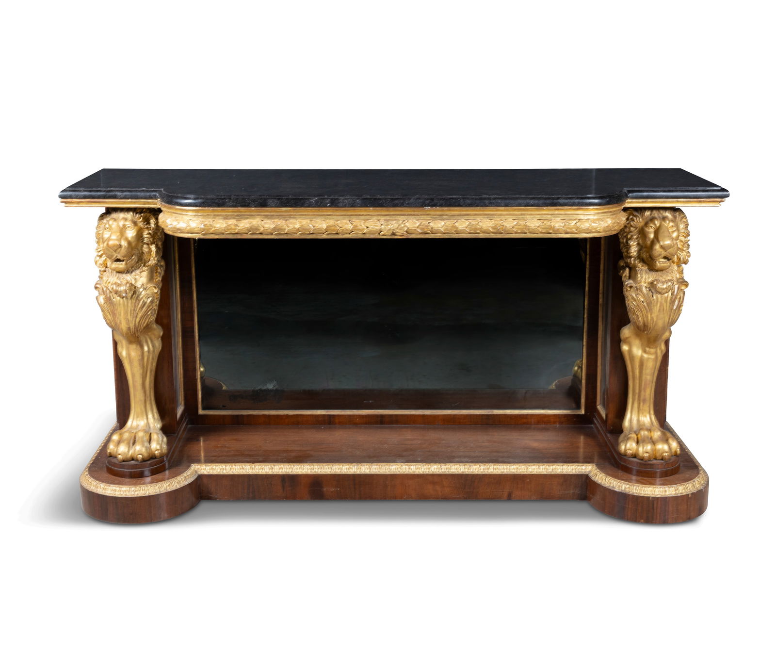 A REGENCY ROSEWOOD AND PARCEL GILT CONSOLE TABLE, CIRCA 1820 of bowfront outline fitted with: A REGENCY ROSEWOOD AND PARCEL GILT CONSOLE TABLE, CIRCA 1820 of bowfront outline fitted with fossil black marble top, above a moulded frieze carved with overlapping laurel leaves, recessed mirrored ba