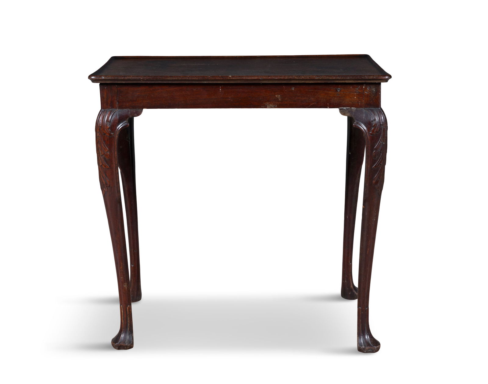 A GEORGE III MAHOGANY TRAY-TOP SILVER TABLE of rectangular form, with solid moulded top above a: A GEORGE III MAHOGANY TRAY-TOP SILVER TABLE of rectangular form, with solid moulded top above a plain narrow frieze and leaf carved cabriole legs and trefid feet. 71.5cm high, 73cm wide, 50cm deep