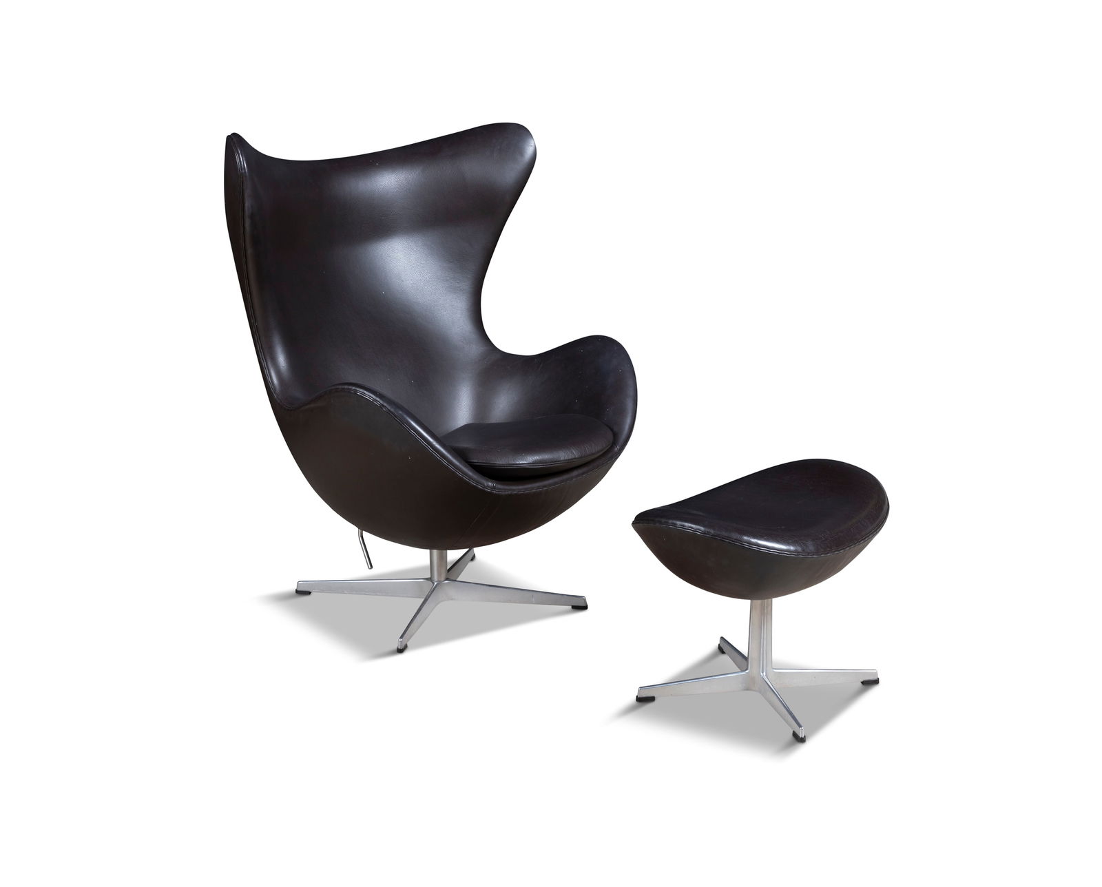 ARNE JACOBSEN (1902-1971)  An 'Egg Chair' with footstool by Arne Jacobsen for Fritz Hansen, (1 of 6)