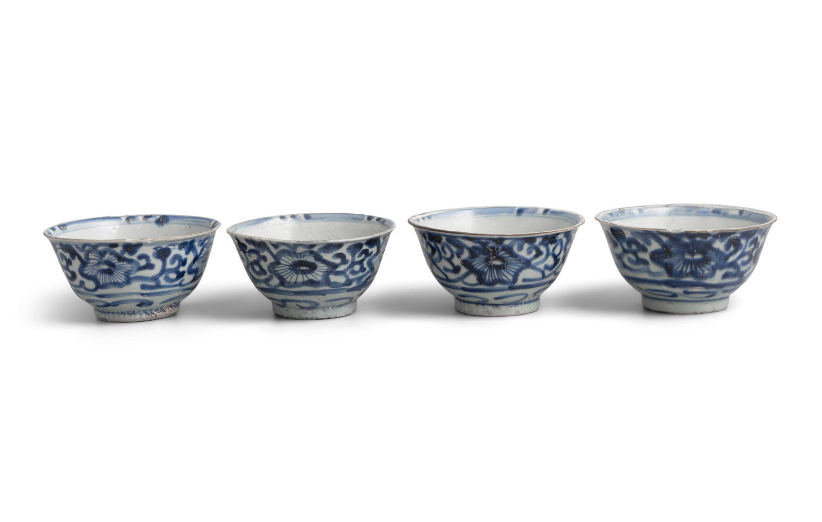 FOUR ‘SCROLLING FLOWERS’ PATTERN BLUE AND WHITE BOWLS China, Yongzheng period, circa
