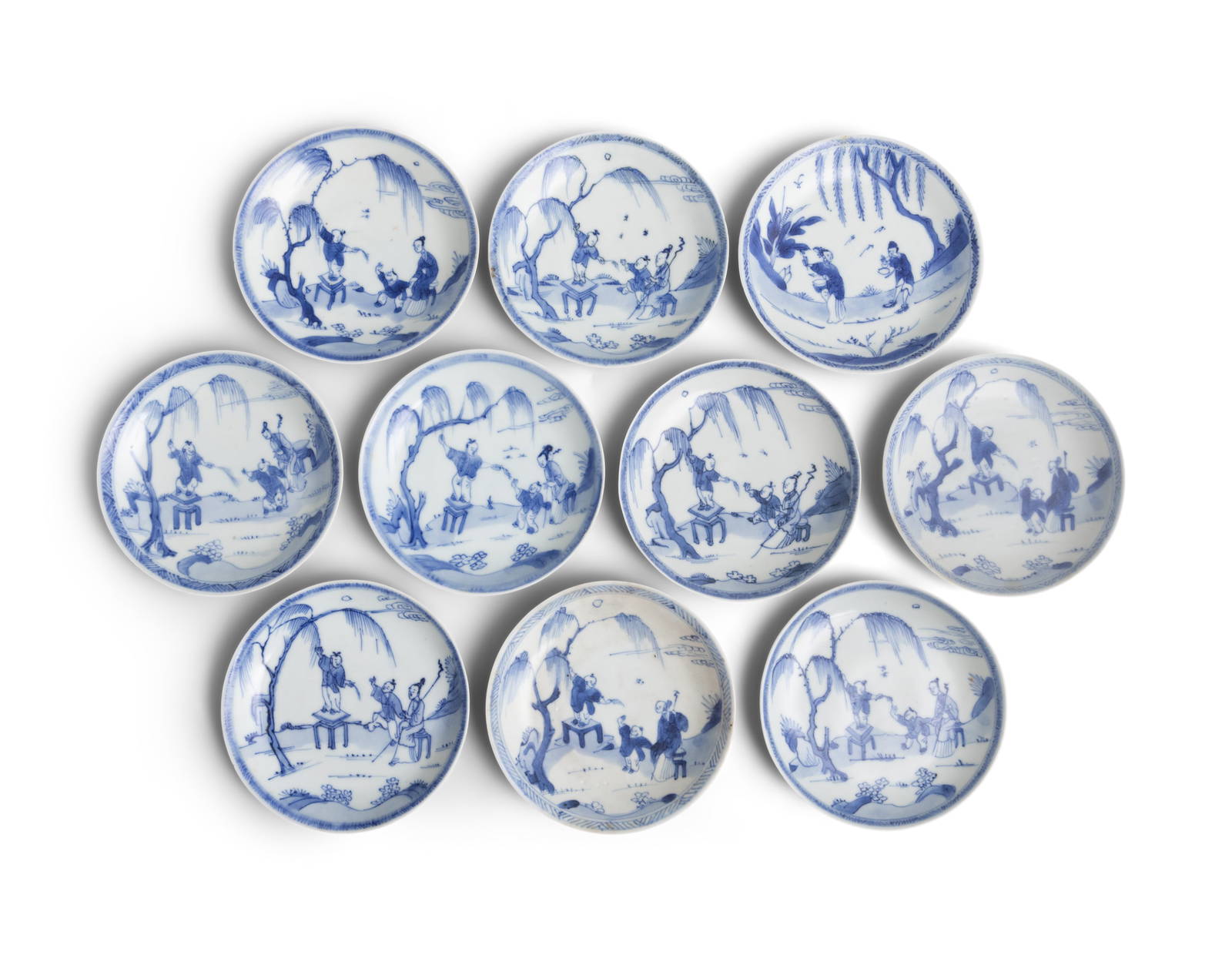 TEN ‘PICKING WILLOW’ PATTERN BLUE AND WHITE SAUCERS China, Yongzheng period, circa 1725