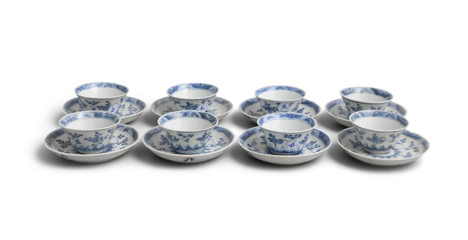 EIGHT ‘RADIATING FLOWERS’ PATTERN BLUE AND WHITE TEABOWLS AND SAUCERS China, Yongzheng