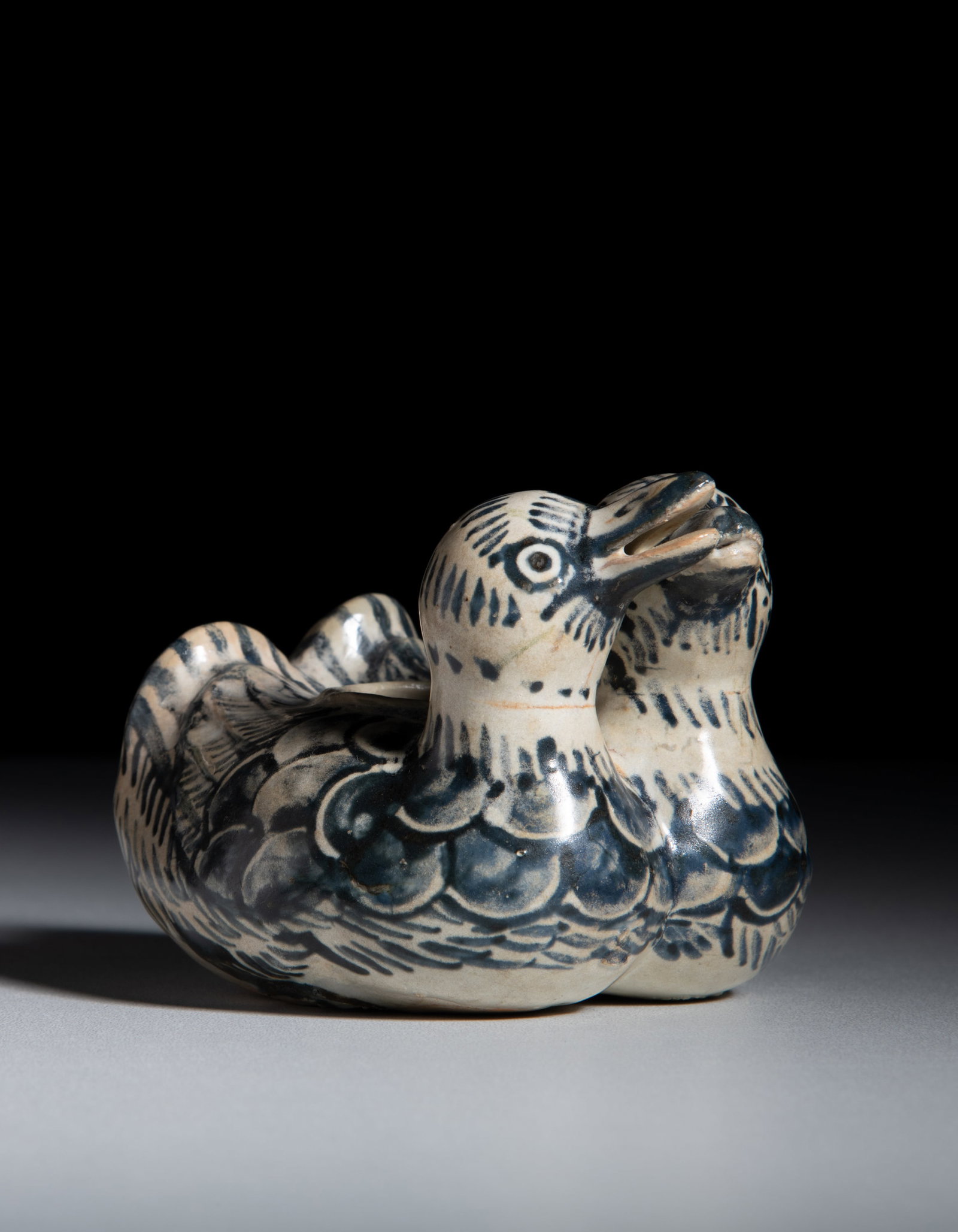 A BLUE AND WHITE DOUBLE MANDARIN DUCKS JARLET Vietnam, Le dynasty, 15-16th century H.7.8cm: A BLUE AND WHITE DOUBLE MANDARIN DUCKS JARLET Vietnam, Le dynasty, 15-16th century H.7.8cm