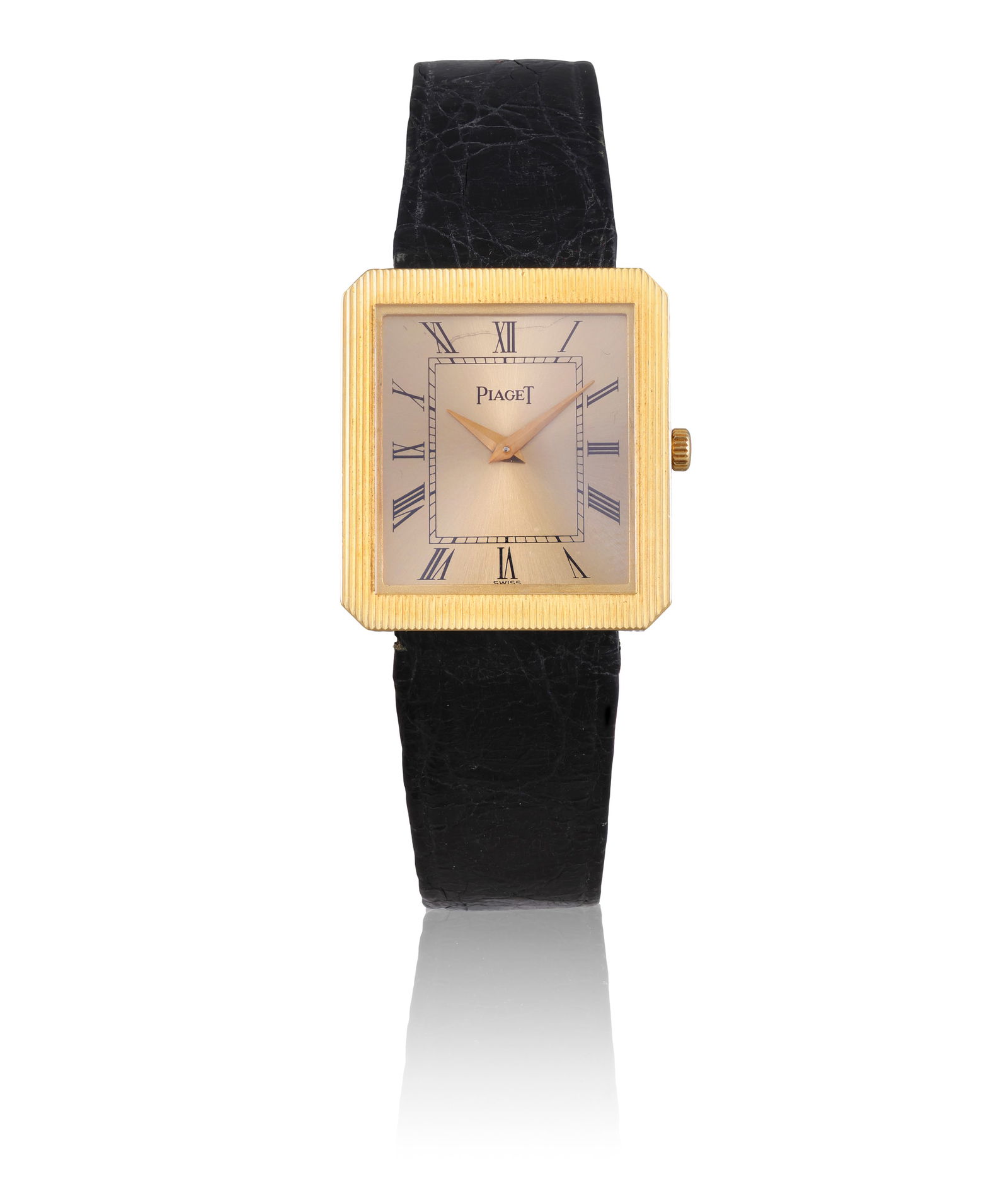 PIAGET REF. 8154, 18K YELLOW GOLD RECTANGULAR QUARTZ WRISTWATCH An 18K yellow gold rectangular wris: PIAGET REF. 8154, 18K YELLOW GOLD RECTANGULAR QUARTZ WRISTWATCH An 18K yellow gold rectangular wristwatch with striped case, quartz movement, circa 1980s. Year: Circa 1980s Dial: Sunburst champagne di