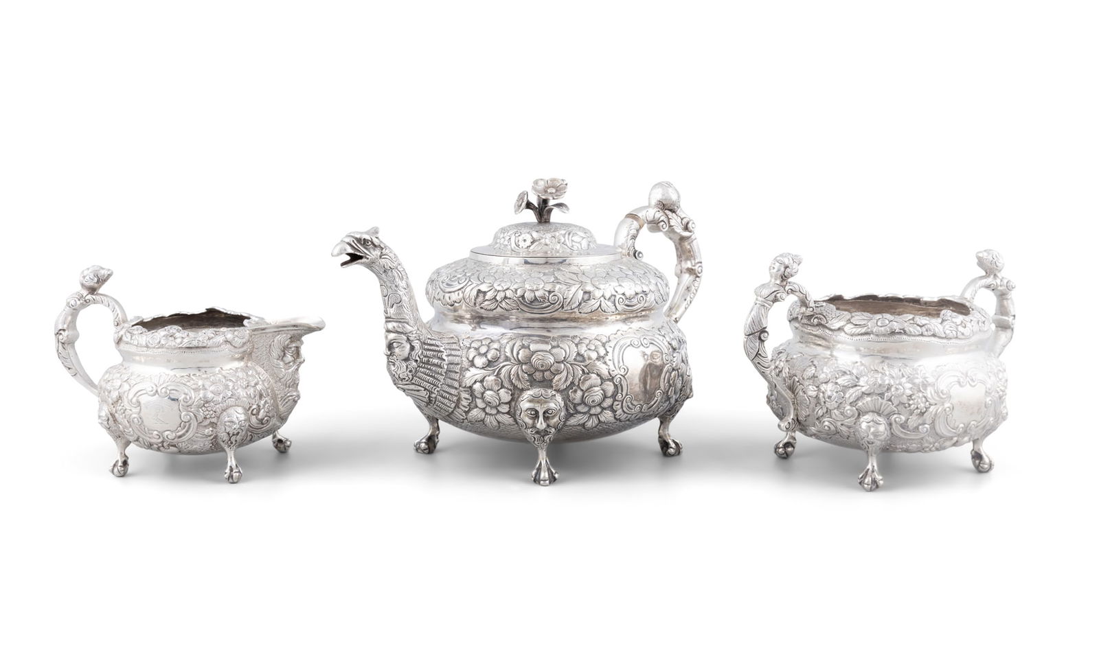 AN IRISH GEORGE IV THREE PIECE TEA SERVICE Dublin c.1824, mark of Edward Power, teapot with flower (1 of 7)