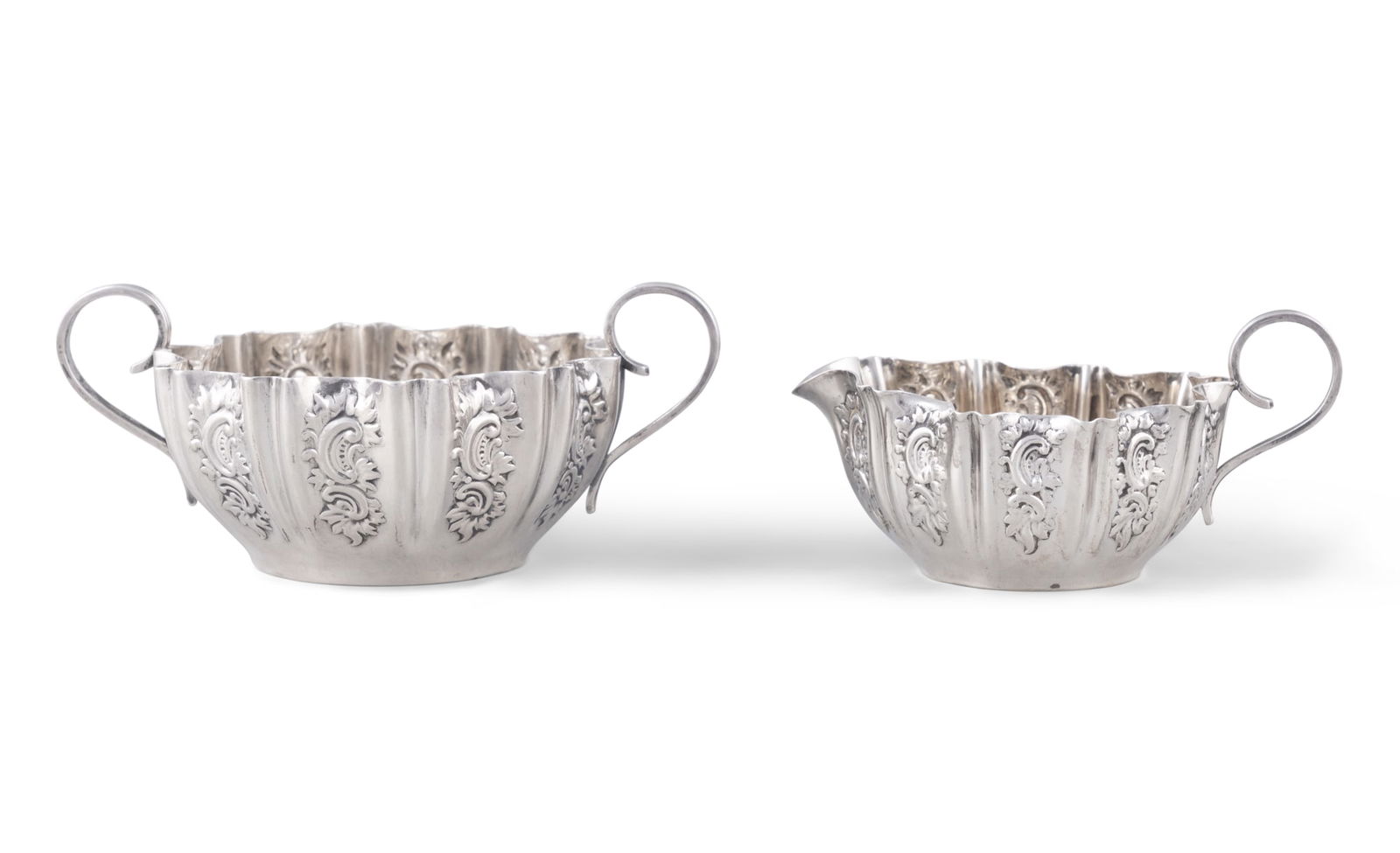A SILVER SUGAR BOWL WITH MATCHING CREAM JUG, Sheffield 1897, each of circular lobed body with (1 of 4)