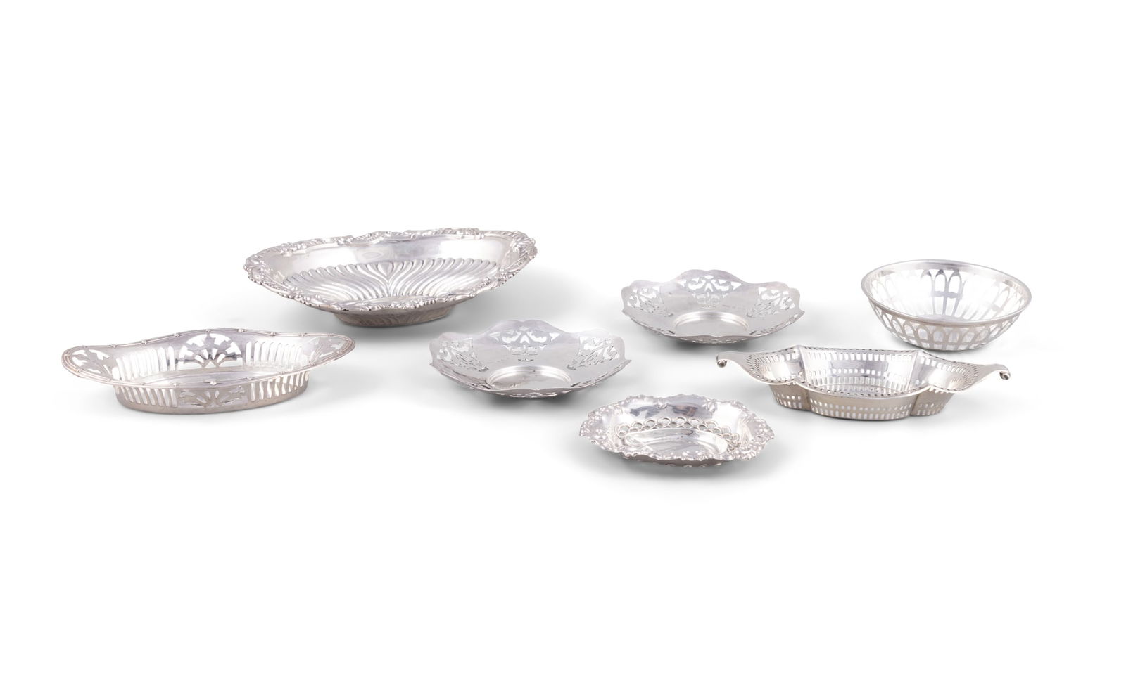 AN ASSORTED COLLECTION OF SEVEN BON BON DISHES, The largest example 18.5cm wide (c.13 troy ozs in: AN ASSORTED COLLECTION OF SEVEN BON BON DISHES, The largest example 18.5cm wide (c.13 troy ozs in all)