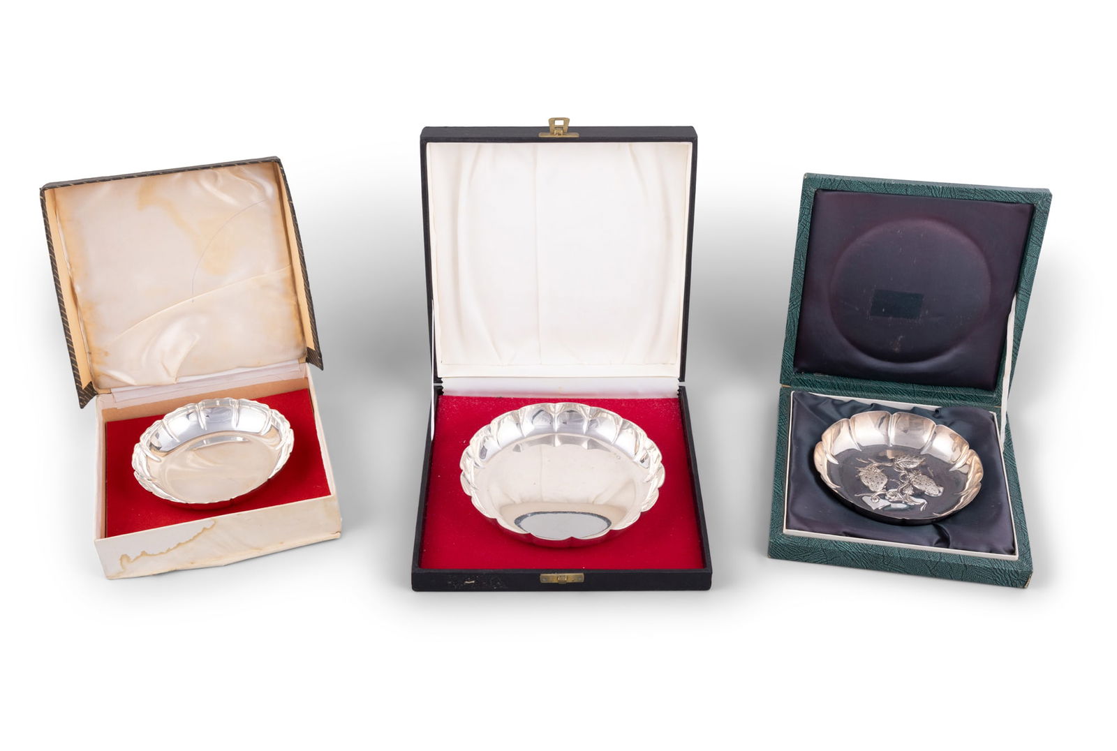 A COLLECTION OF THREE CASED SILVER STRAWBERRY DISHES, comprising: - a small twelve panel strawberry (1 of 4)
