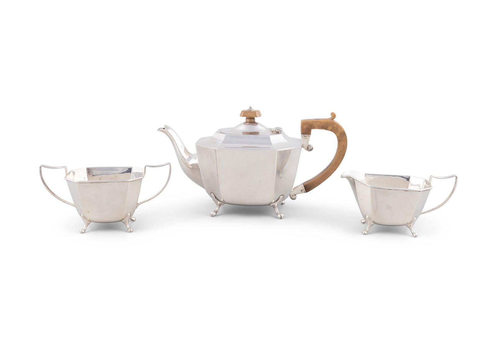 A THREE PIECE SCOTTISH SILVER TEA SERVICE, comprising a teapot, sugar bowl and creamer, Glasgow (1 of 6)