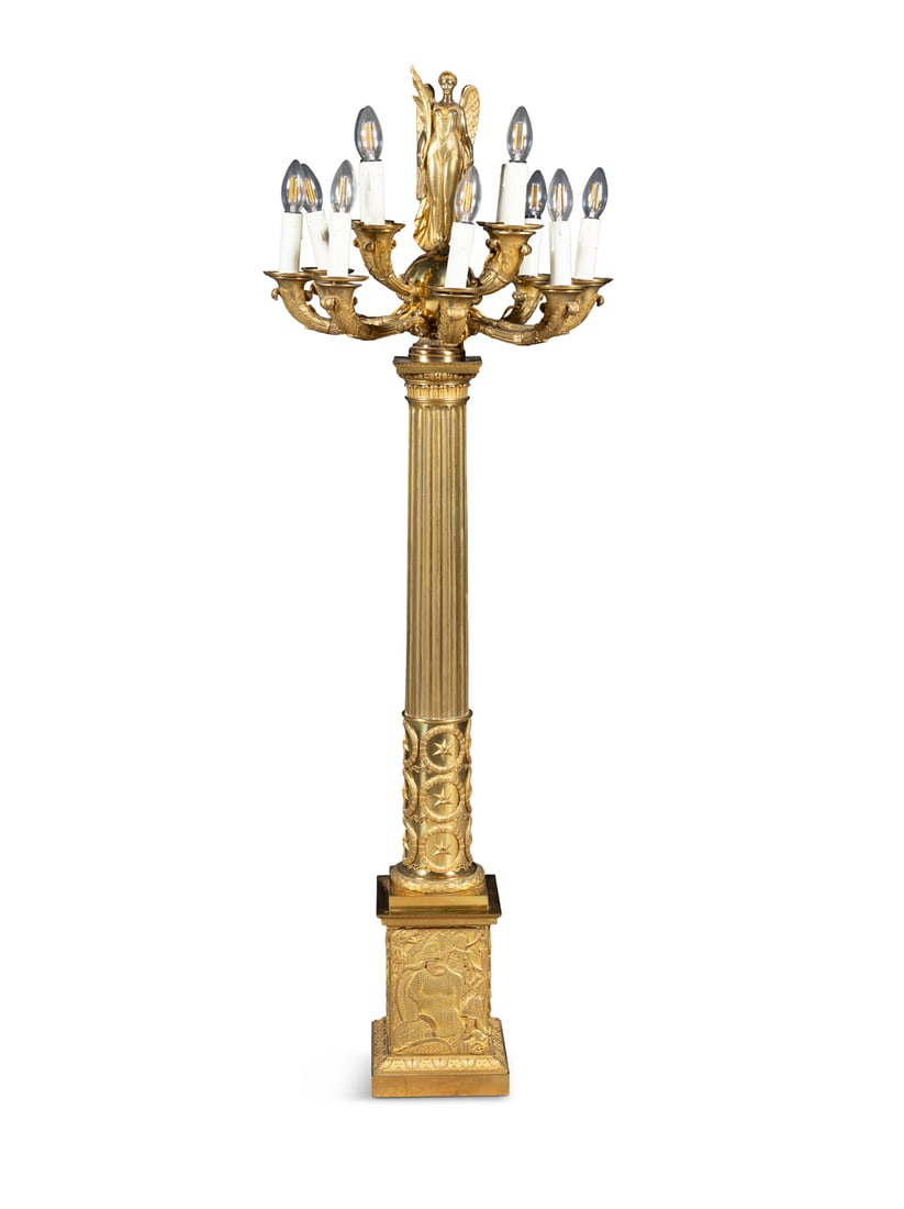 A FRENCH GILT BRONZE NINE LIGHT CANDELABRUM IN THE EMPIRE STYLE, 19TH CENTURY surmounted by a (1 of 5)