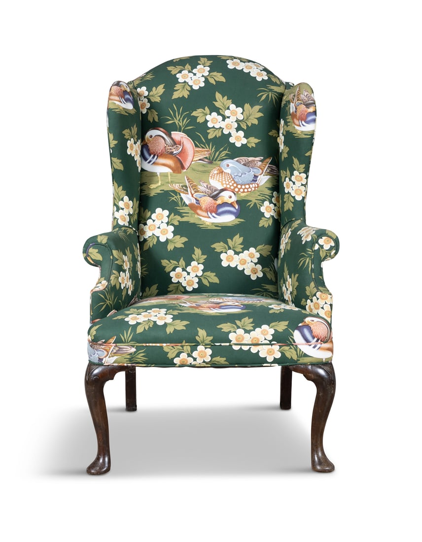 A GEORGIAN MAHOGANY FRAMED WINGBACK ARMCHAIR covered in deep green fabric with Mandarin ducks and: A GEORGIAN MAHOGANY FRAMED WINGBACK ARMCHAIR covered in deep green fabric with Mandarin ducks and pond grasses, on cabriole legs and pad feet