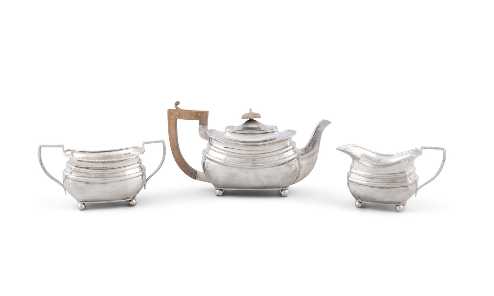 A SILVER THREE PIECE TEA SERVICE Chester c.1926, mark of S Blankensee & Son Ltd, with gadrooned (1 of 7)