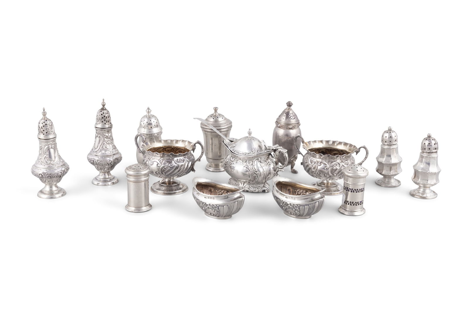 A COLLECTION OF SILVER CONDIMENT PIECES, including open salts, mustard pots and shakers (c.14 troy (1 of 9)