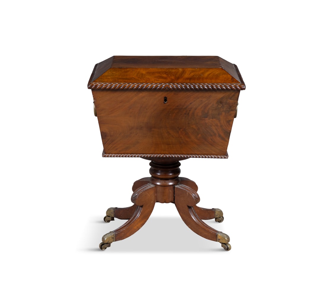 A GEORGE IV MAHOGANY SARCOPHAGUS SHAPED WINE CELLARETTE hinged top with gardrooned rim, opening to (1 of 5)