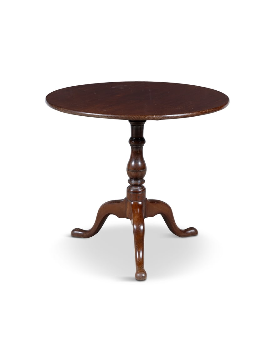 A GEORGE III MAHOGANY CIRCULAR TILT TOP WINE TABLE the solid panel top with moulded edge, on a (1 of 5)