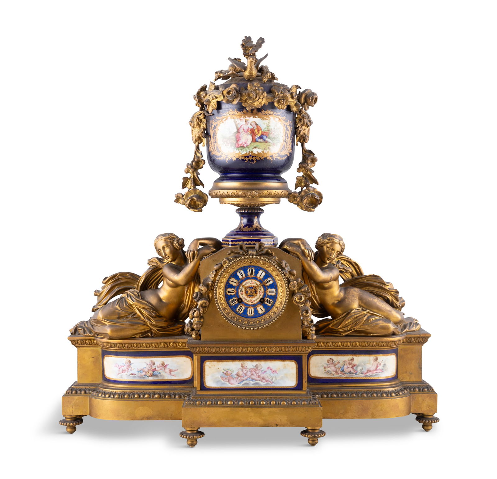 A FRENCH GILT METAL MOUNTED AND PORCELAIN MANTEL CLOCK, LATE 19TH CENTURY, surmounted by an urn (1 of 7)
